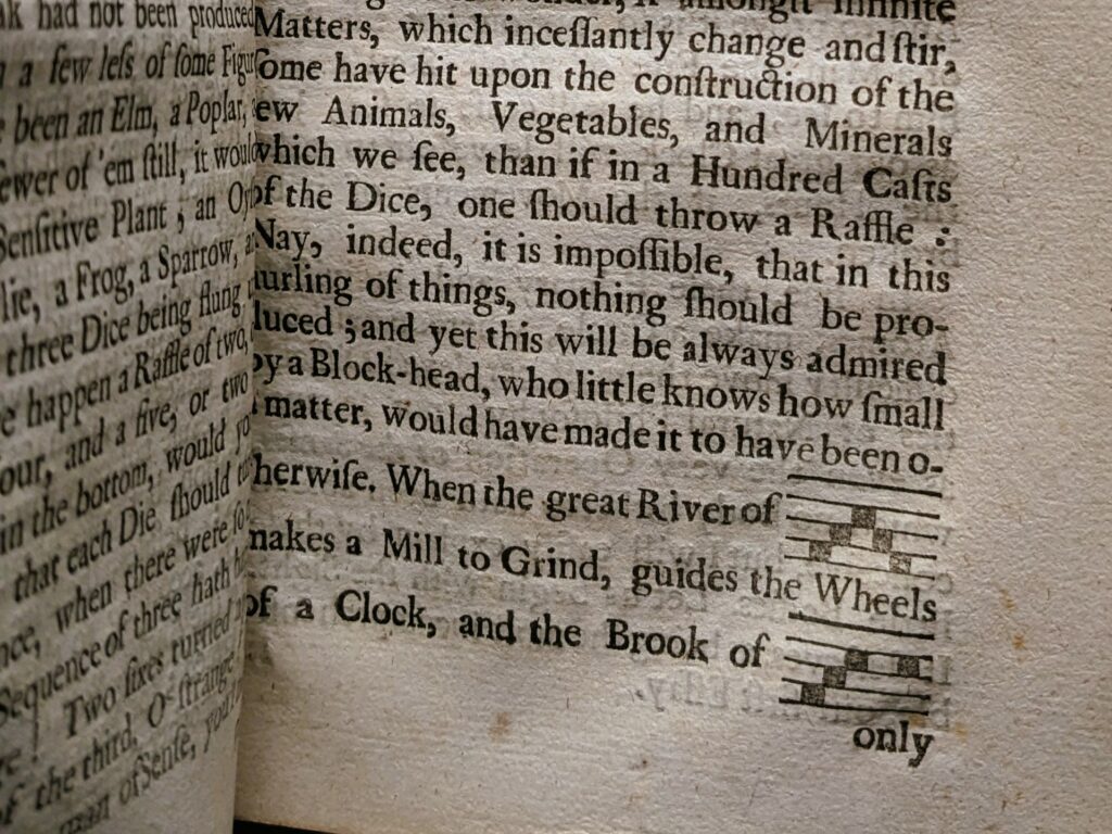 Close up of page showing text and music score