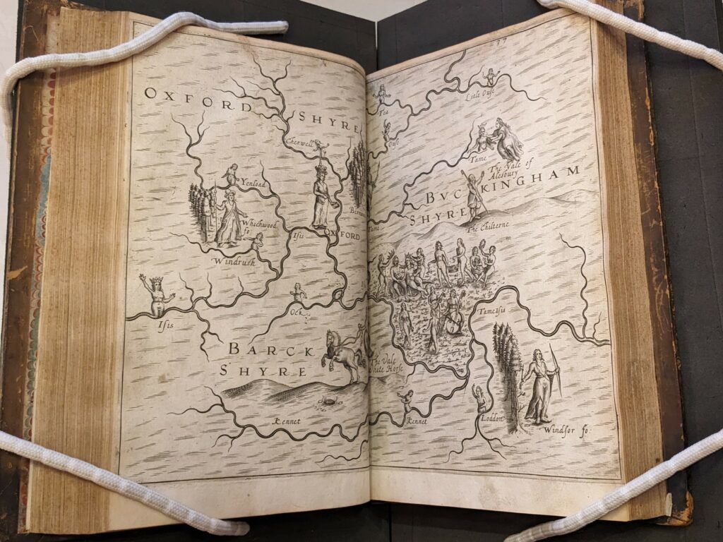 Two page opening of map showing Oxfordshire, Buckinghamshire and Berkshire. The map shows the rivers and hills of the counties along with human figures representing these topological features.