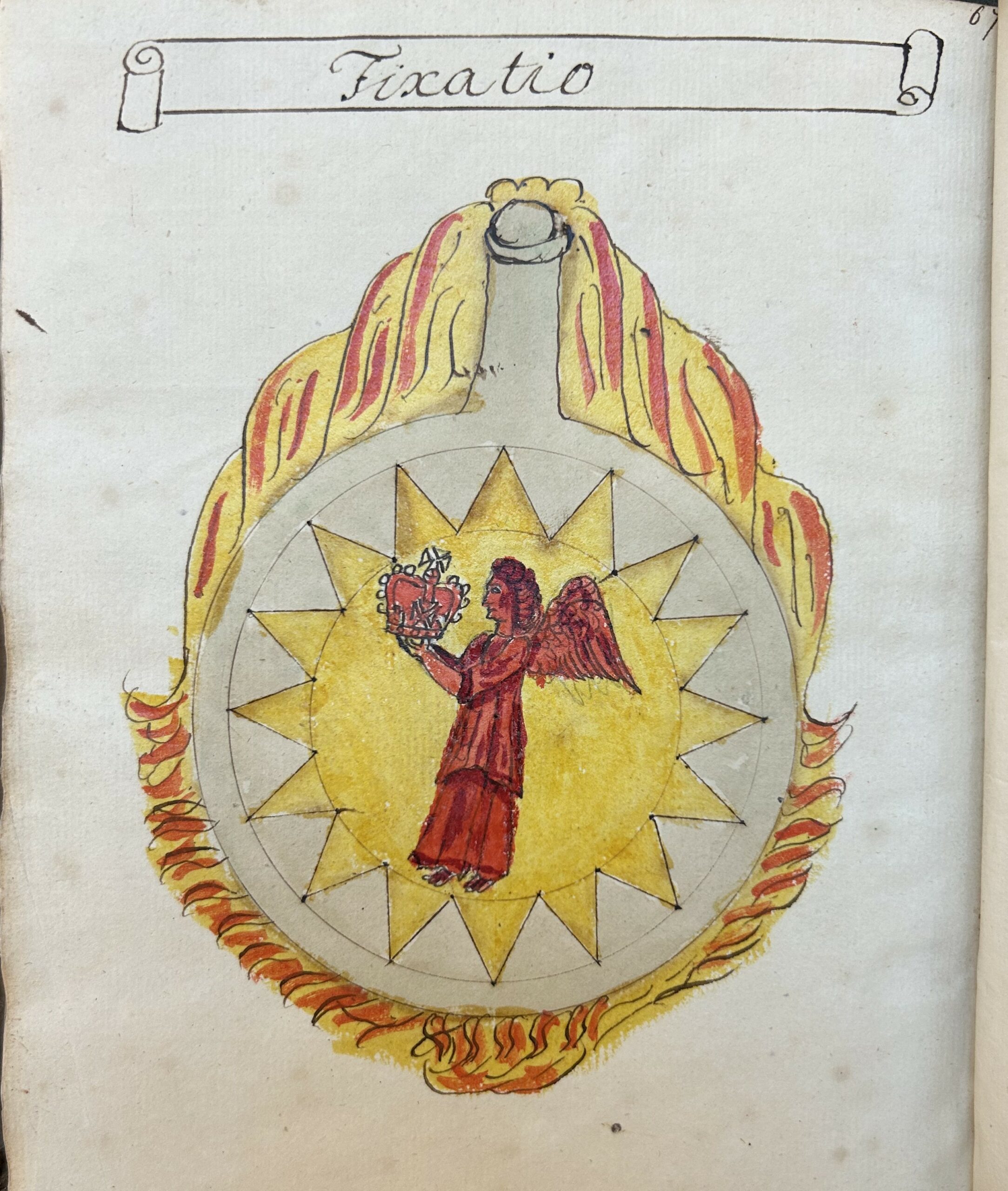 Book opening showing a handwritten page with a banner in black ink reading 'Fixatio'. Below is a circular beaker surrounded in red and yellow flames. In the beaker is a yellow star and in the star is a red winged person holding up a crown.